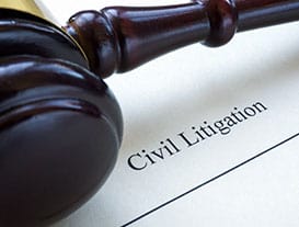 Close-up of a gavel resting on a document with the words 